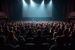 freepik__a-large-crowd-of-people-sitting-in-a-theater-or-au__16423